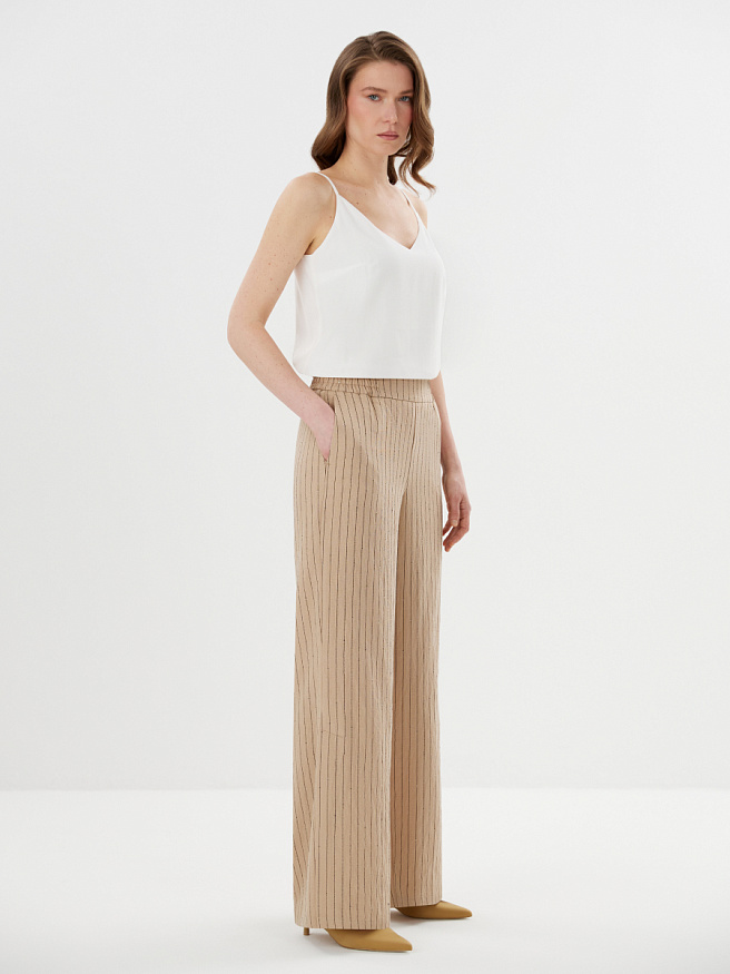 Легкие брюки из ткани в пайетку