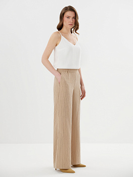 Легкие брюки из ткани в пайетку